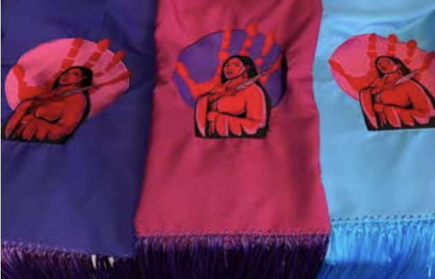 The three shawls featuring the “No More Stolen Sister” artwork, representing the spectrum of violence. / Photo courtesy of Connie Brushbreaker