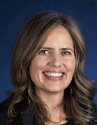 Official portrait of Samantha Dziatkiewicz, smiling against a blue background.