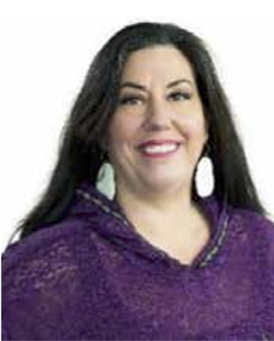 Portrait of Tammy “Paniiqchuugak” (Bu-nick-chuck) Ashley smiling, wearing a purple top and white earrings, with a plain white background.